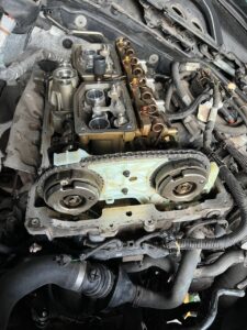 Engine valve cover removed, showing components